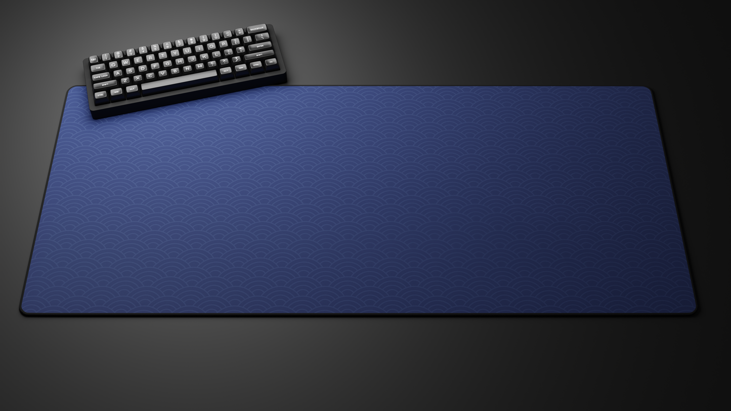 Keyboard on large blue desk mat
