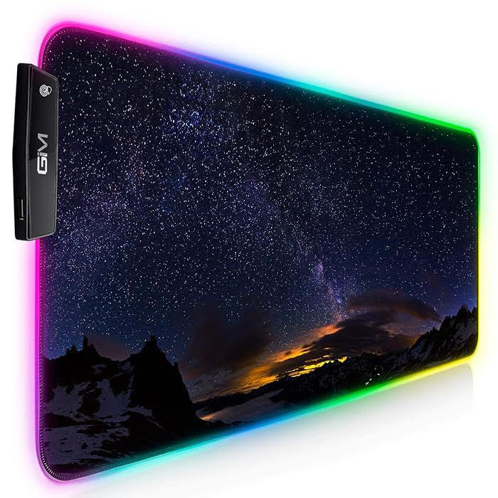 LED-lit gaming mouse pad with a starry night design